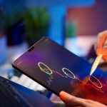 Person analyzing cryptocurrency trends on a tablet with digital pen. — A Funded Trading Account Lets You Trade Without Capita