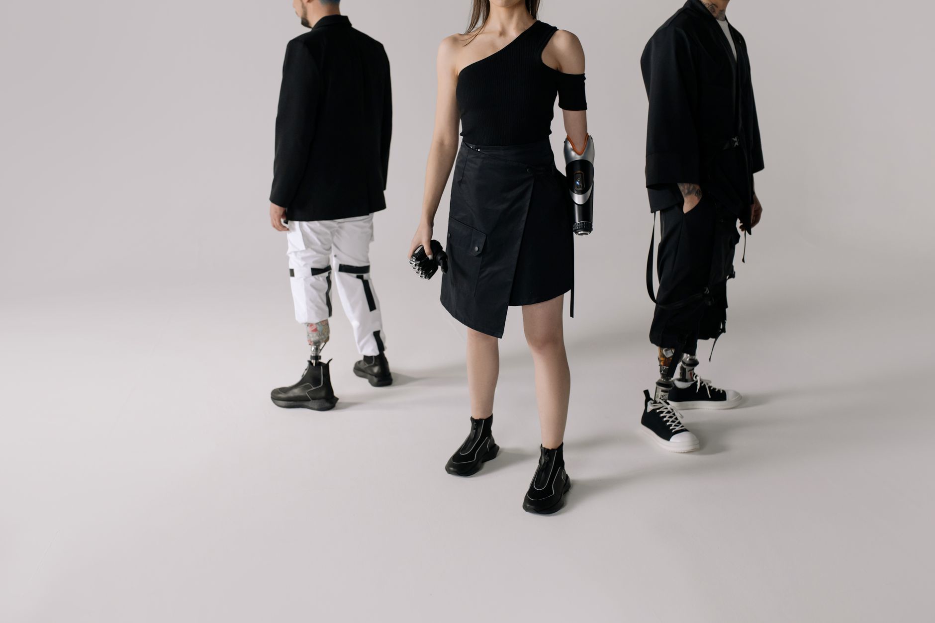 Stylish individuals with prosthetics showing modern fashion and strength. — Bible Necklace: How Faith Becomes Fashion in Mode