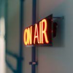 Bright red 'On Air' neon sign captured indoors, ideal for media content. — Boxing Streams Offer Ringside Viewing from Anywher
