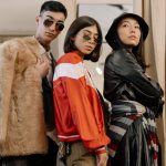 Three adults in fashionable attire posing confidently, reflecting retro and vintage styles. — Christian Engagement Gifts: Beh