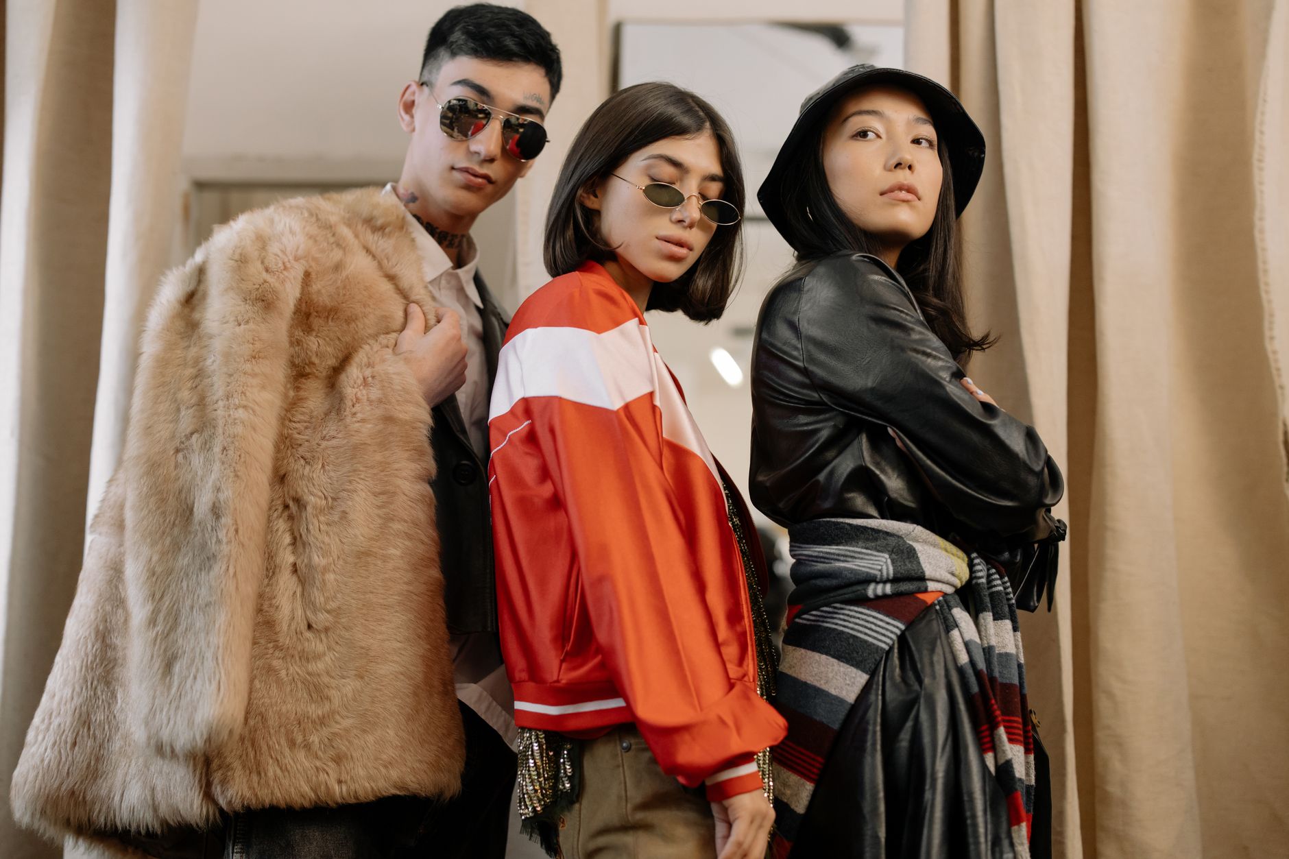 Three adults in fashionable attire posing confidently, reflecting retro and vintage styles. — Christian Engagement Gifts: Beh