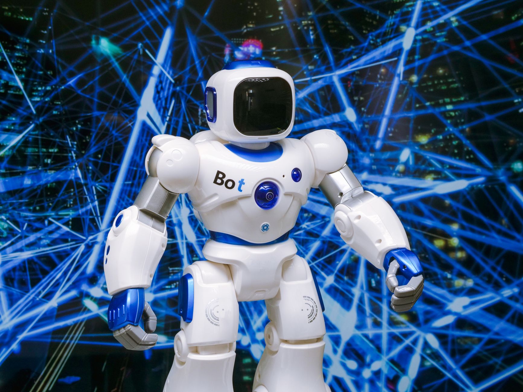 Advanced humanoid robot with glowing blue accents in a digital network setting. — How Artificial Intelligence Enhances Human-