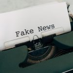 Close-up of vintage typewriter printing 'Fake News', depicting false information concepts. — How Rayo Vallecano Stands Out in