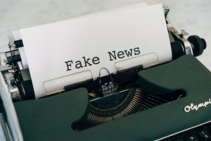Close-up of vintage typewriter printing 'Fake News', depicting false information concepts. — How Rayo Vallecano Stands Out in