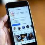 Close-up of a smartphone displaying an Instagram profile screen. — Secrets Revealed: White Label Facebook Ad Tactics That Con